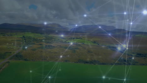 network of connections and data processing animation over scenic landscape