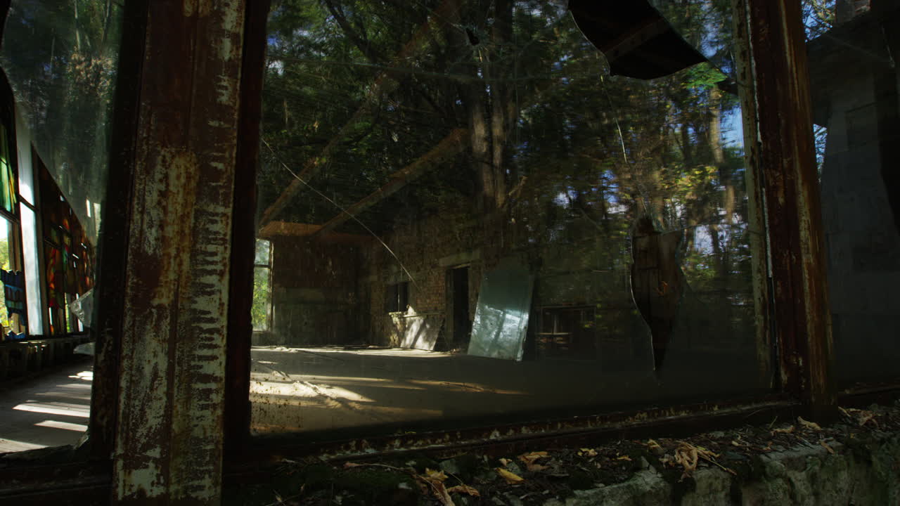 Pan left shot of derelict, empty Cafe Prypiat during daytime