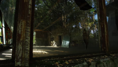 Pan-left-shot-of-derelict,-empty-Cafe-Prypiat-during-daytime