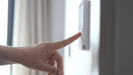 A-finger-turning-on-lighting-switch