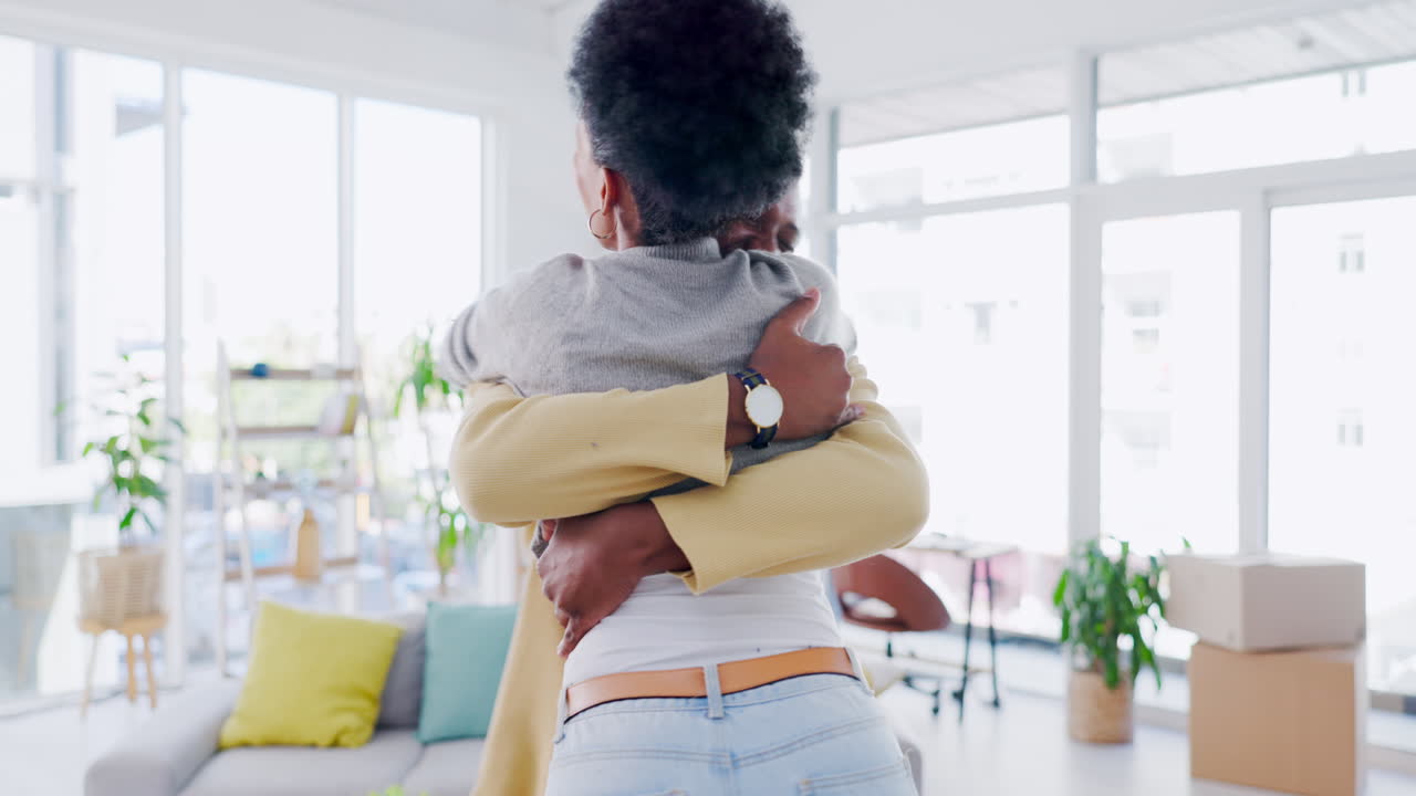 Love, happy and black couple hug in lounge