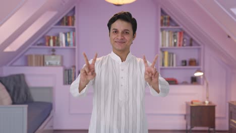 Happy-Indian-man-showing-victory-sign