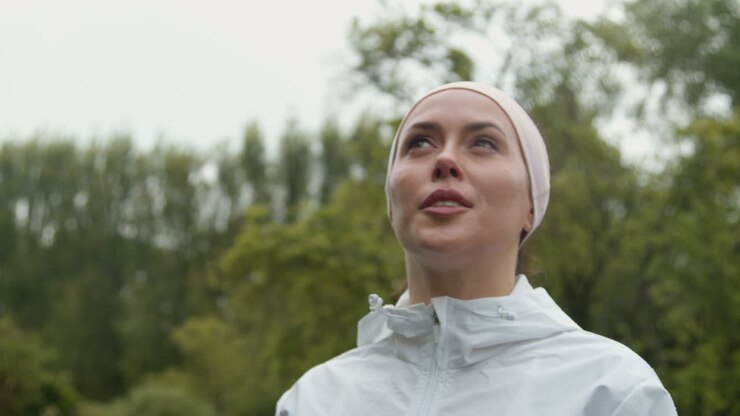 Close Up Of Woman Wearing Headband Exercising Keeping Fit Running In Rain 2
