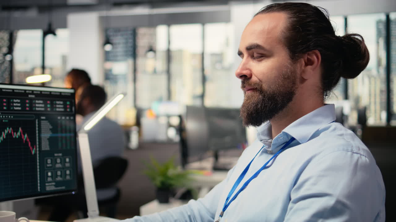 Close up of happy day trader analyzes stock market price candlestick charts