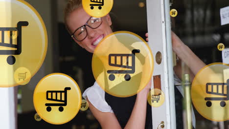 animation of shopping cart icons, caucasian female barista welcoming by standing and opening door