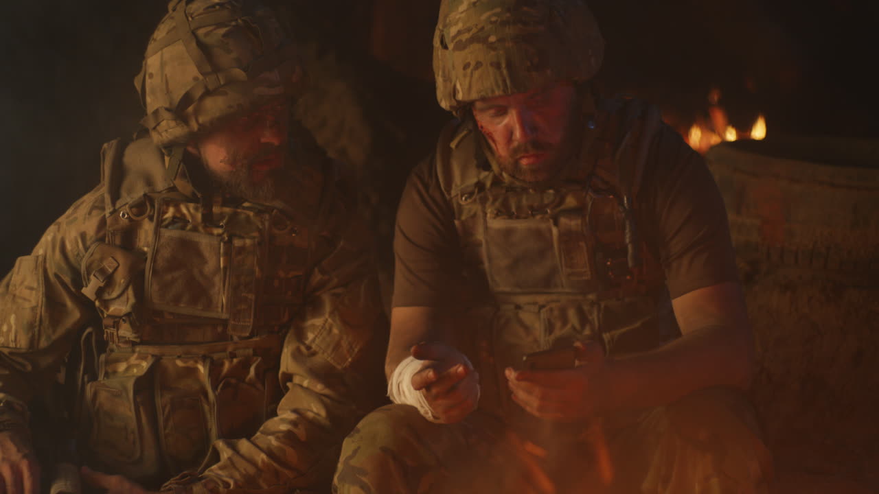 Soldiers Discussing Near Campfire at Night