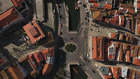 aerial top down shot over landmark downtown waterway, aveiro