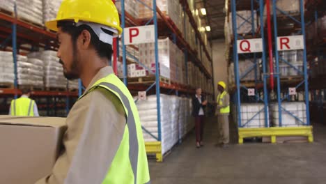 Portrait-of-young-man-working-in-a-warehouse-smiling-4k