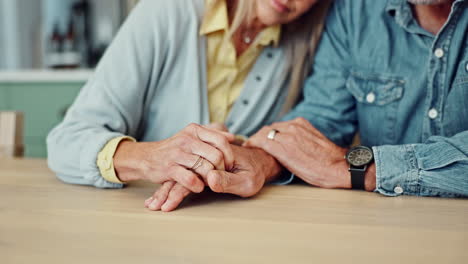 a loving senior couple holding hands