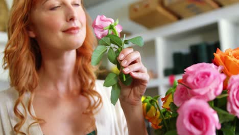 Female-florist-smelling-flower