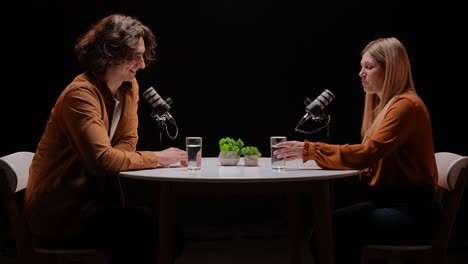 two people recording a podcast or interview