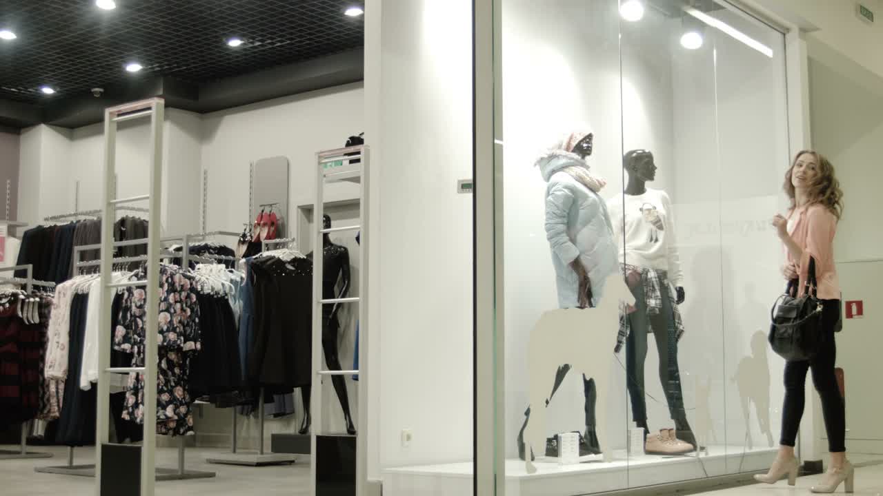 Two Girls Look At a Show-window Of Shop