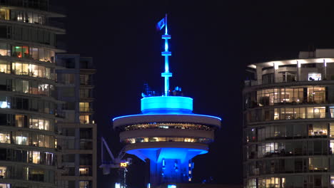 Illuminated-Vancouver-Lookout-In-Harbour-Centre-Skyscraper-At-Nigth-In-CBD,-Downtown-Vancouver,-Canada