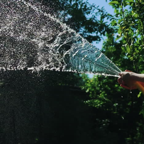 watering the green grass, close up. slow motion