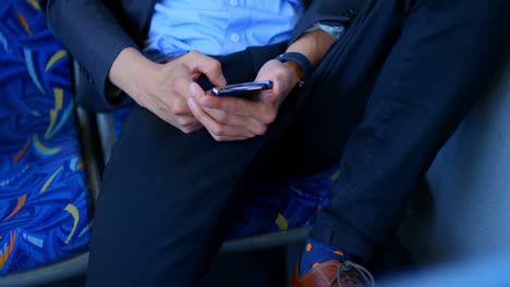 male commuter using mobile phone while travelling in bus 4k