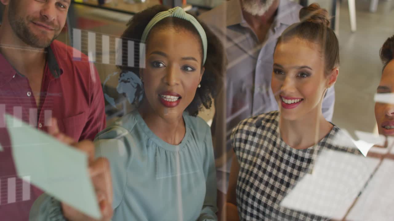 Businesswoman placing postit on glass causing globe and data bars growing team reaching consensus