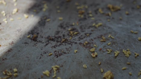 scattered food scraps on a dirty surface
