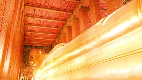 golden buddha statue in ornate temple setting