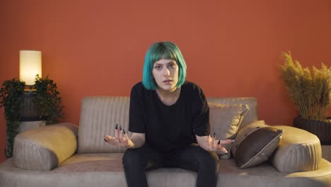 depressed young woman talking to camera.