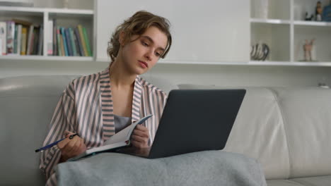 Focused-student-watching-webinar-at-home-office-closeup.-Thinking-lady-study