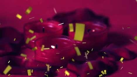 animación de confeti amarillo sobre velas rojas ardiendo en un entorno oscuro