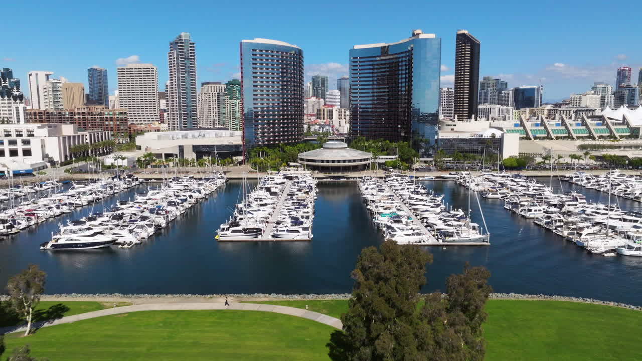 Downtown Skyline And Marina Filled With Boats In San Diego Bay, California, United States. Aerial Pullback Shot