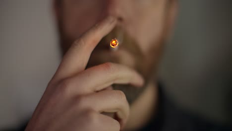 man smoking cigarette