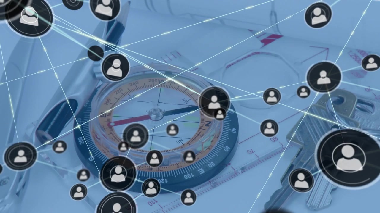 Icon fading above compass expanding network mapping connections over sketches, ruler and keyring