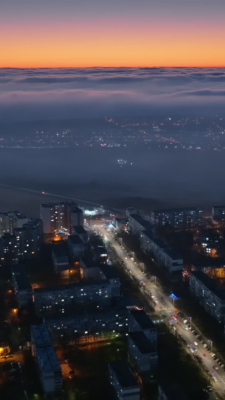 Aerial drone view of cars in traffic in Chisinau, Moldova at sunset. Vertical
