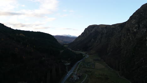 Road-winds-through-dark-Queenstown,-New-Zealand's-adventure-capital