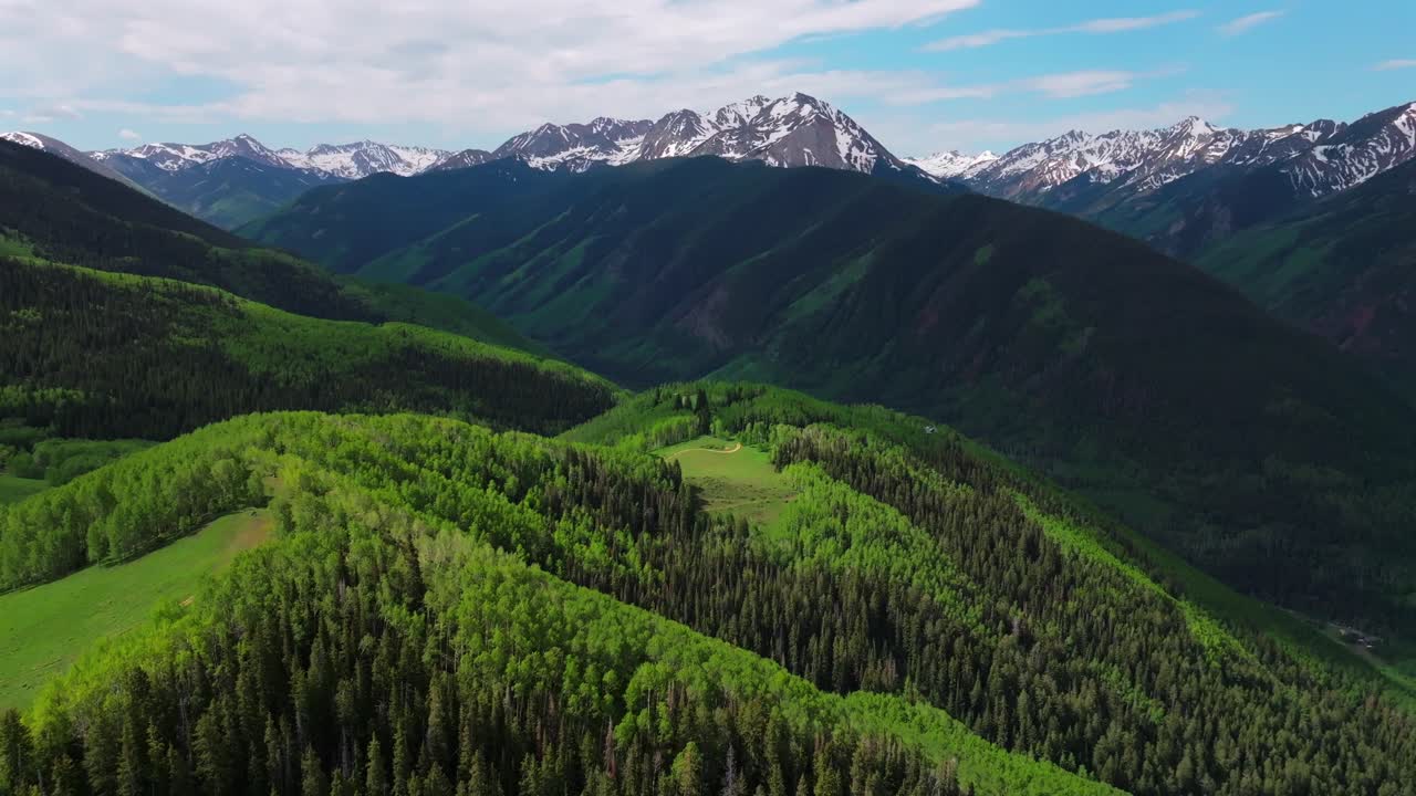 AJAX Aspen Mountain backcountry spring summer Rocky Mountain Conundrum Creek Castle Peak aerial drone Ashcroft Little Annie Trail Basin 4wd road morning blue sky cabins Aspen trees grove pan left