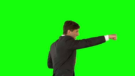 Businessman-punching-on-green-screen