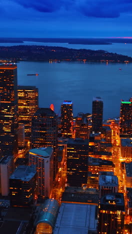 downtown seattle night city street. nightlife drone american city. vertical video