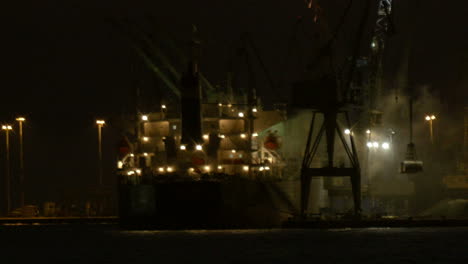 unloading cargo ship at night 2