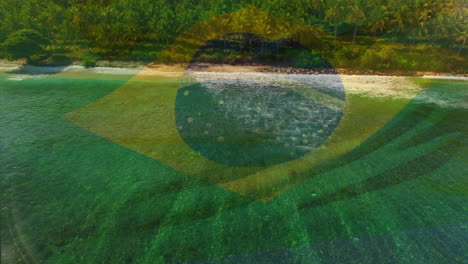 digital composition of waving brazil flag against aerial view of the sea