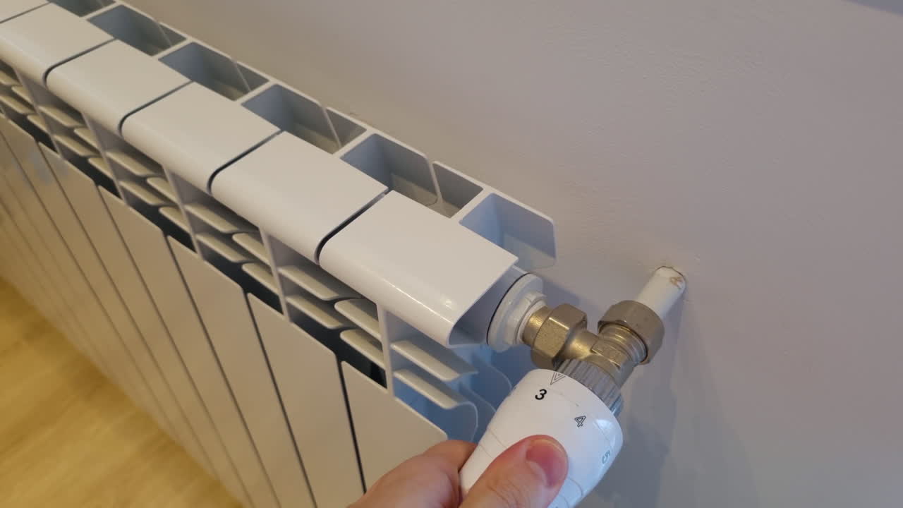 regular la temperatura en la casa con un termostato en el radiador