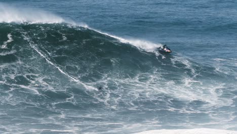 slow motion of a big wave surfer kai lenny from hawaii riding a monster wave in nazaré, portugal