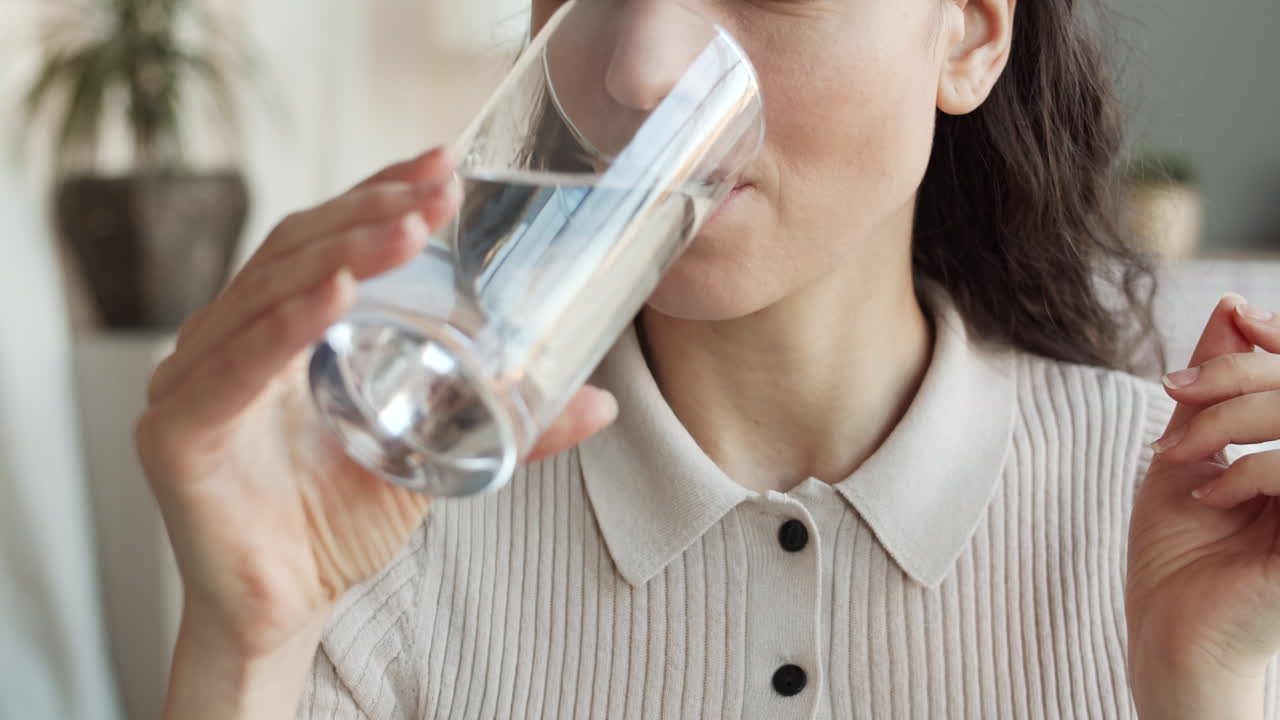 Unrecognizable Woman Taking Vitamin Pill
