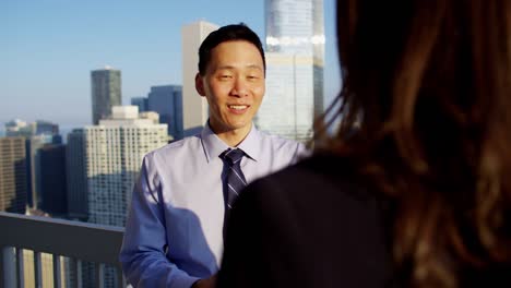 multi ethnic management team meeting on chicago rooftop