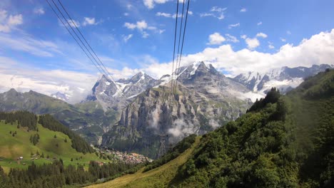 timelapse: gondola ride, ascent with a beautiful view on the swiss alps landscape, rocky mountains and green valleys