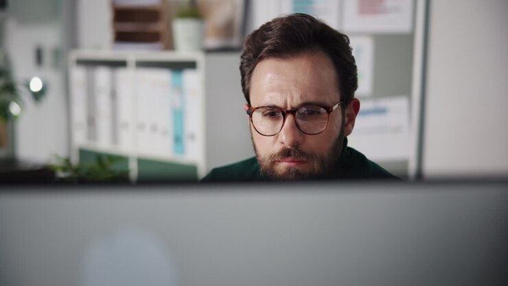 Man working on computer in office