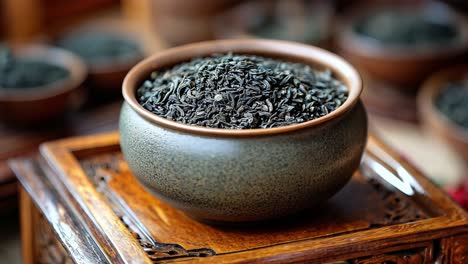 bowl of tea leaves on wooden tray