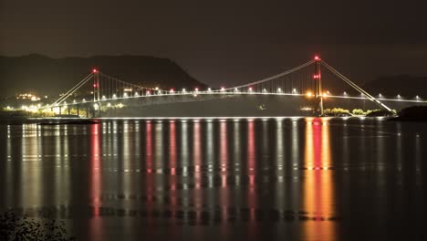 night view of the gjemnessund bridge from over the fjord