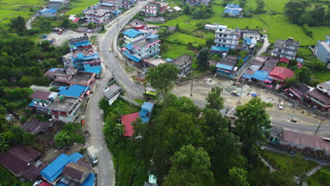 a vista of buildings near himalayas mountains in the countryside of nepal, south asia