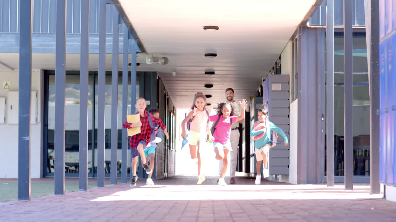 In a school corridor, a group of students are running excitedly