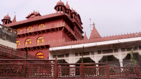 ancient-artistic-red-stone-holy-jain-temple-at-morning-video-is-taken-at-Soni-Ji-Ki-Nasiya-Jain-Temple,-Ajmer,-Rajasthan,-India