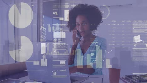 animation of statistical data processing over african american woman talking on smartphone at office
