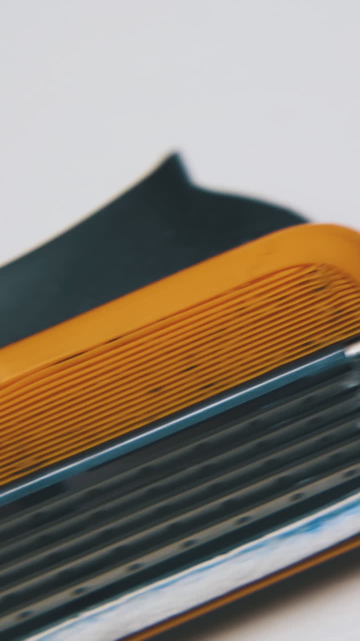 modern shiny cassette for man shaving razor lies on clean white background extreme close view