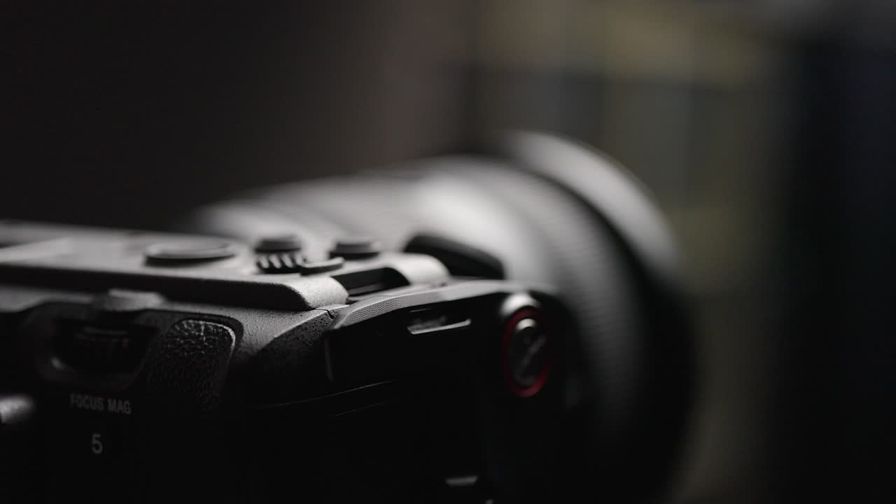 Close-up view of the lens cap being removed from the Sony FX3