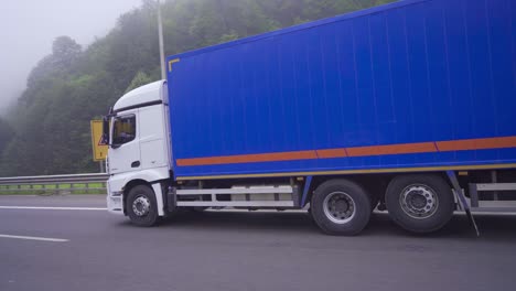 truck carrying cargo on asphalt road.